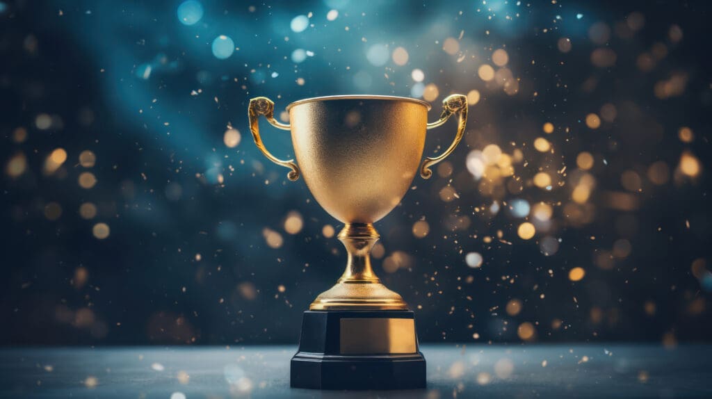 Achievement success in education awards concept. Golden trophy cup winner on bokeh background. Congratulation in university Achievement success in education awards concept. Golden trophy cup winner on bokeh background. Congratulation in university